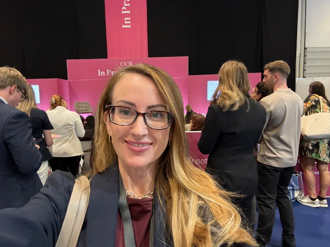 Alexis Drake at CCR London, with the In Practice stage and conference attendees behind her